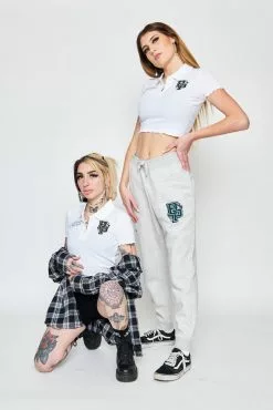 BROKEN PROMISES Poor Sport Cropped Polo Top Womens