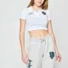 BROKEN PROMISES Poor Sport Cropped Polo Top Womens